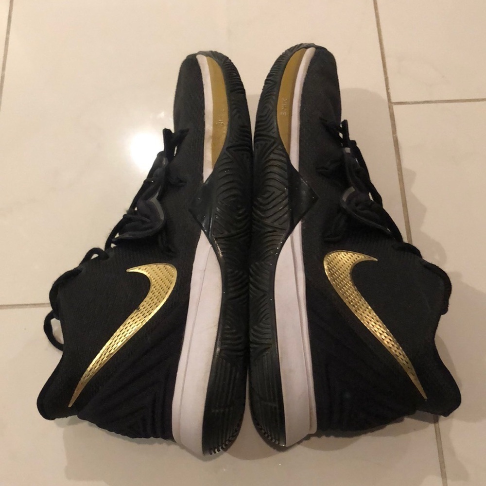 Nike black : gold youth kyrie 5 basketball / running shoes.